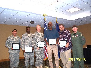 Winners from the 45th Space Wing C in March are (l-r): Senior Master Sgt. Richard Saldana, USAF; Tech. Sgt. Damon Webb, USAF; Senior Master Sgt. William Byrd, USAF; Kenneth Williams; Joshua Booth; and presenter Col. Sleeth. 